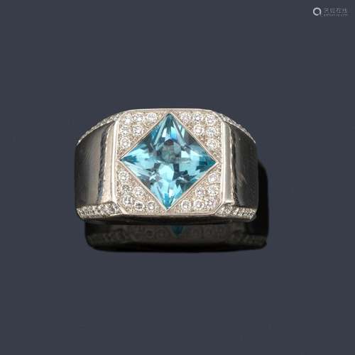 Ring with central blue topaz with diamond pavé set…