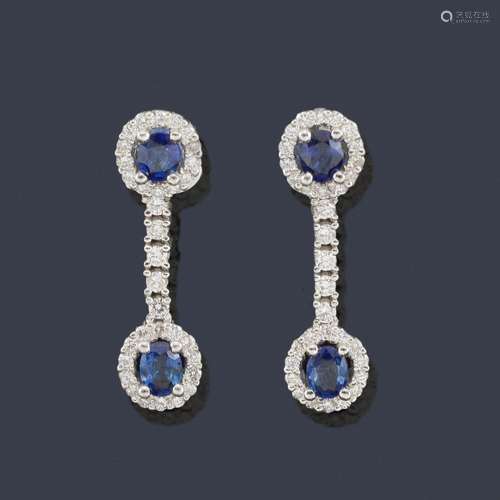 Long earrings with oval cut sapphires and brillian…