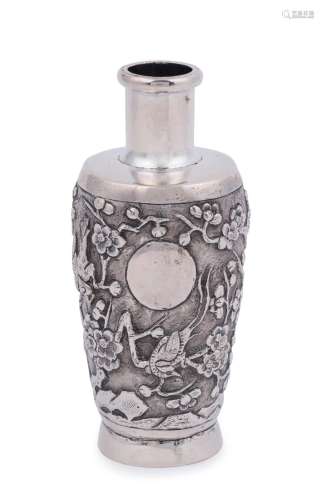 An antique Chinese export silver vase with embossed birds an...