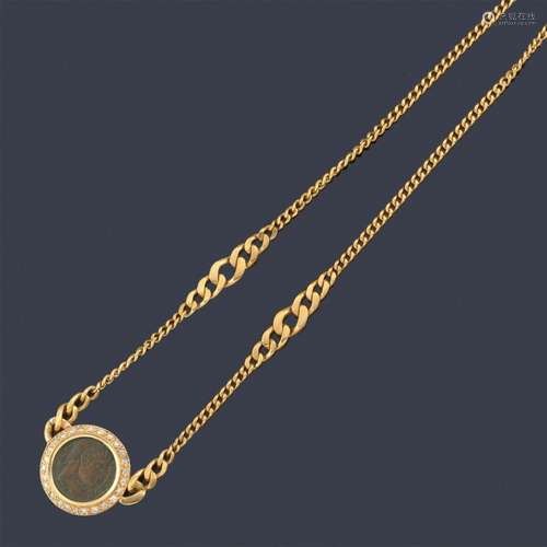 Necklace with an ancient Roman coin with a border …