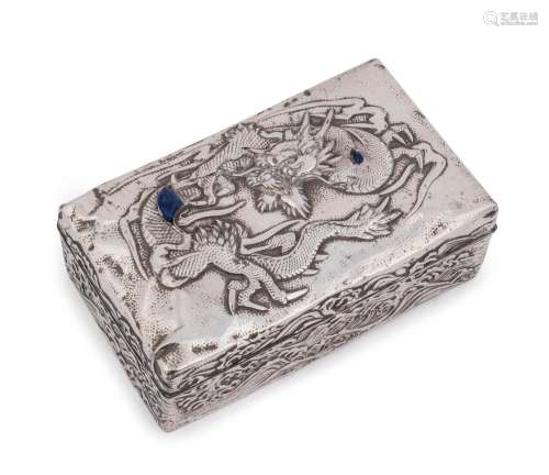 An antique Chinese silver box adorned with a dragon in seasc...