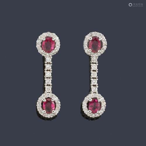 Long earrings with four oval cut rubies and brilli…