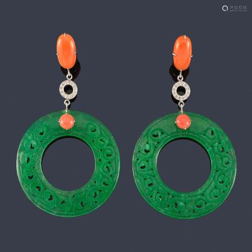 Long earrings with two pieces of jade in the shape…