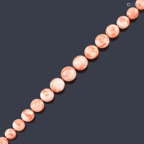 Necklace of spherical beads of pink coral in decre…