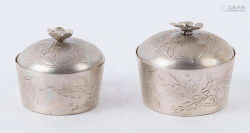 Two Chinese silver lidded pots with flower finials, 20th cen...