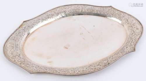 A Chinese silver serving tray with embossed floral and scrol...