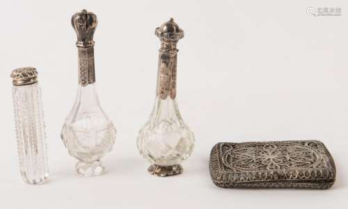 Three antique Continental silver mounted scent bottles and a...