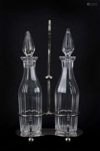An English silver plated decanter stand with two crystal dec...
