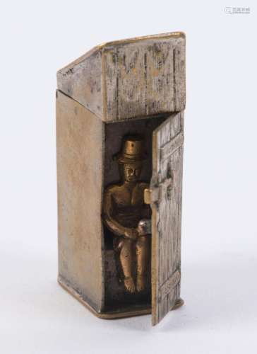 An antique novelty vesta in the form of an outhouse with sid...