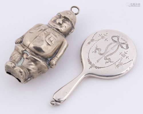 A silver plated policeman baby rattle together with an antiq...