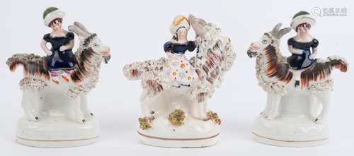 Three antique English Staffordshire pottery statues of girls...