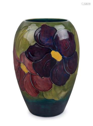 MOORCROFT "Clematis" English pottery vase on green...