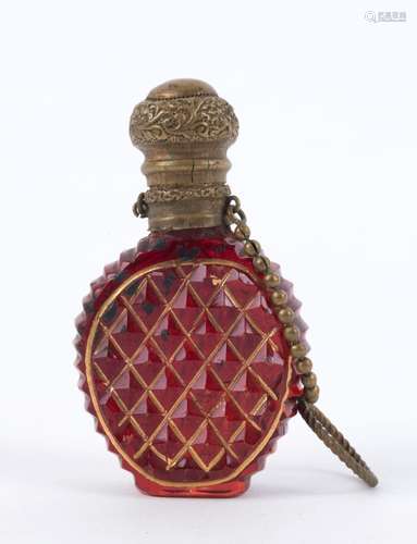 An antique Bohemian scent bottle, cut ruby glass with gilt m...