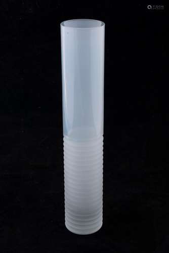 A cylindrical white art glass vase, most likely Scandinavian...