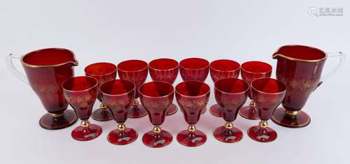 A pair of Murano ruby glass pitchers and 12 matching glasses...