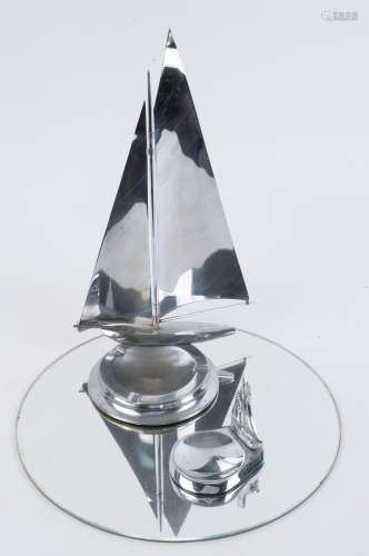 Two chrome yacht ashtray ornaments with glass circular base ...