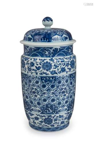 A Chinese blue and white lidded porcelain vase with geometri...