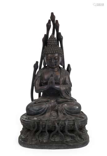 A Chinese bronze Buddha statue with snakes, Republic period,...