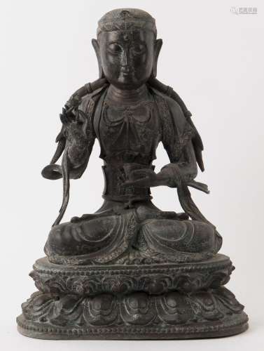 A Tibetan bronze seated Amitayus statue on a double lotus ba...