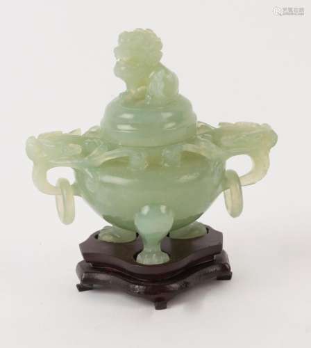 A Chinese carved green jade lidded censer with dragon handle...