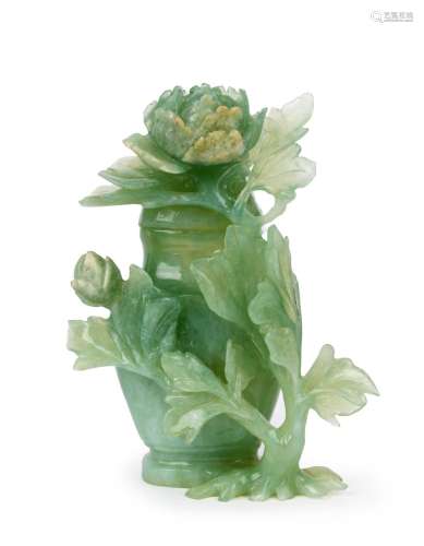 A Chinese carved jade lidded jar decorated with peony flower...