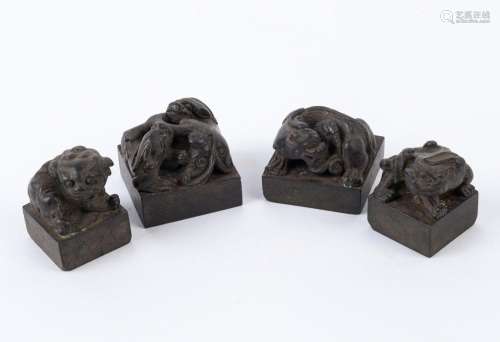 Four Chinese bronze seals with Chi-long dragon finials, Qing...