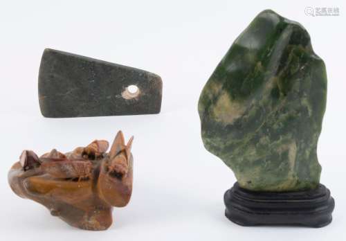 An antique jade axe head, nephrite scholar's rock, and ...