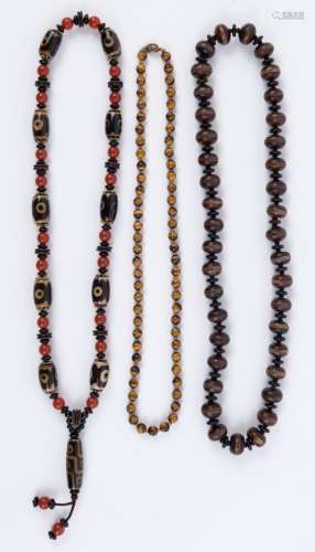 Three Sino-Tibet bead necklaces including tiger's eye, ...