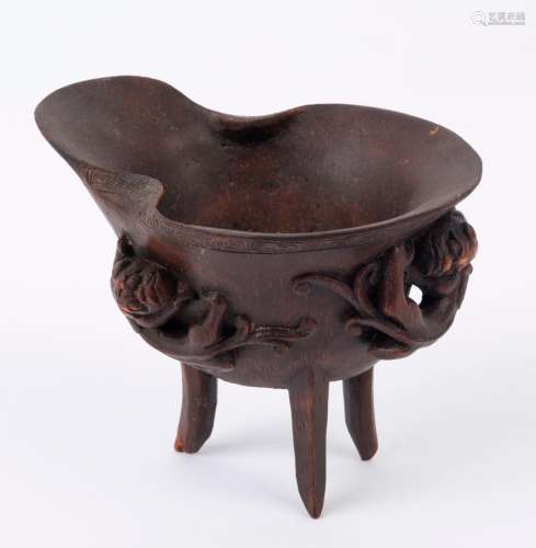 A Chinese carved bamboo libation cup adored with three Chi-l...