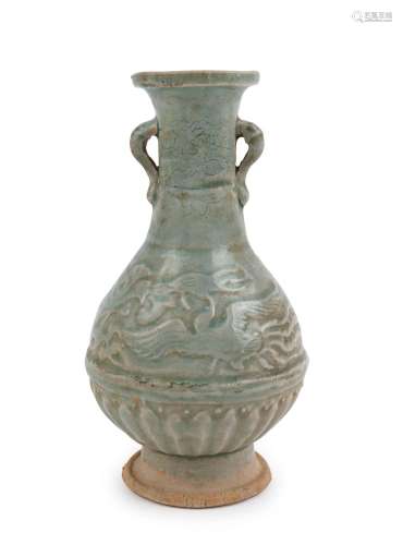 An antique Chinese celadon vase with embossed phoenix design...