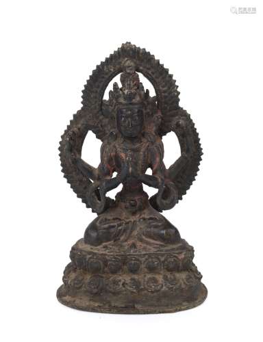 A Himalayan cast bronze statue of the four-armed Bodhisattva...
