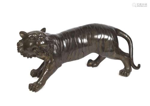 A Chinese bronze tiger statue, 20th century, 58cm high, 135c...