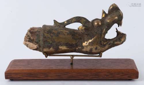 A Chinese dragon finial, gilt metal and wood, in the archaic...