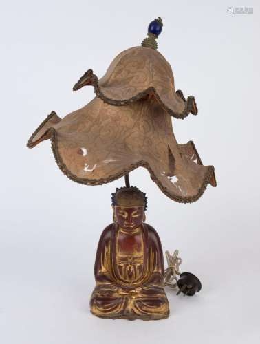 A vintage Chinese table lamp and shade with carved Buddha ba...