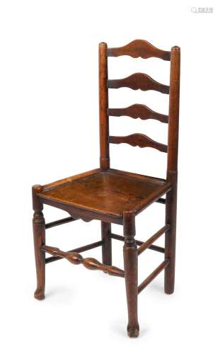 An English ladderback chair, turned and carved elm, circa 17...