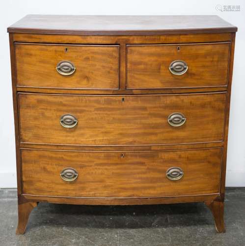 A Georgian bowfront mahogany chest of four drawers with reed...