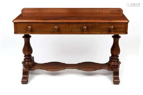 An antique mahogany side table with shaped stretcher platfor...
