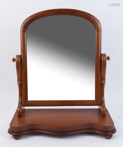 An antique mahogany toilet mirror with serpentine front, cir...