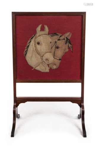 An antique fire screen, carved walnut with tapestry and appl...