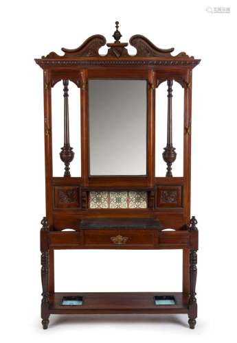 An antique English walnut hallstand with tile back and black...