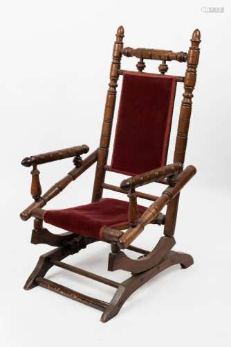 An American walnut bobbin turned spring back rocking chair, ...