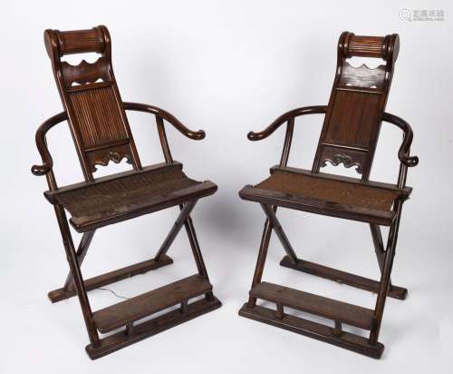 A pair of Chinese rosewood folding yoke chairs, 20th century...