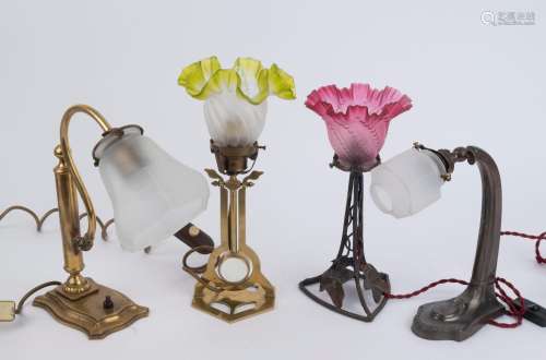 Four assorted table lamps with glass shades, early 20th cent...