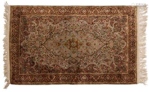 A Persian hand knotted silk rug, 20th century, 150 x 92cm