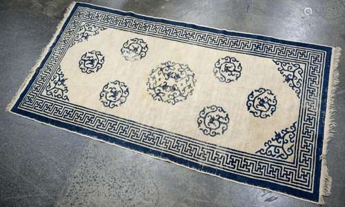 An antique Chinese hand-woven blue wool rug, circa 1920, 185...