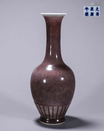 A red glazed porcelain vase