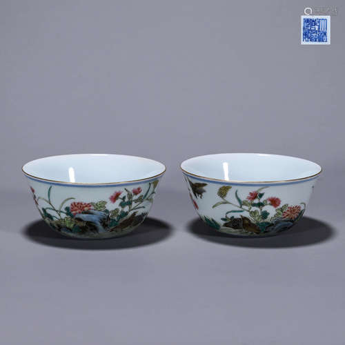 A pair of famille rose bird and flower porcelain cups