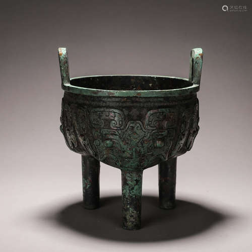 A taotie patterned bronze three-legged pot