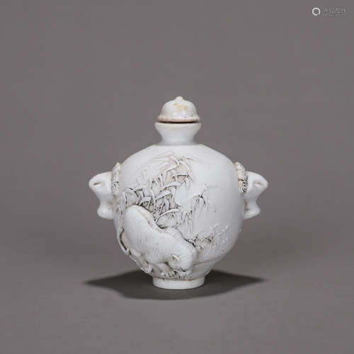 A beast carved porcelain snuff bottle