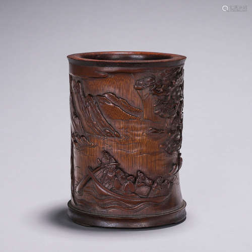 A carved bamboo brush pot